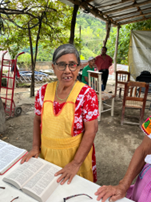 Miguel's mom receiving reading glasses